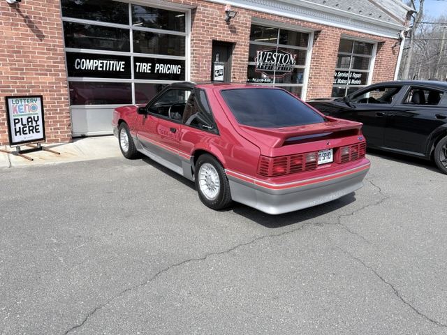 Red Mustang outside Weston Automotive